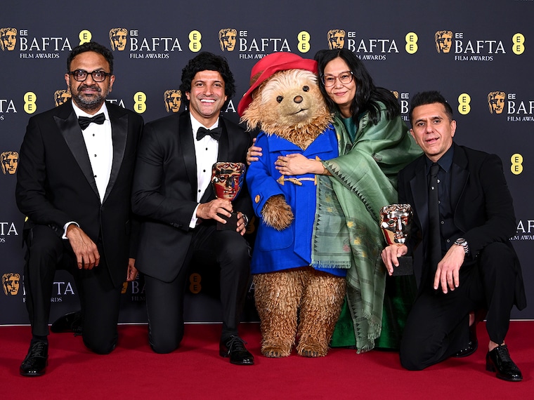Lakshimipriya Devi and Ritesh Sidhwani accept the Children's & Family Film Award for 'Boong' with Alan McAlex, Farhan Akhtar and Paddington Bear during the 2026 EE BAFTA Film Awards, held at the Royal Festival Hall on February 22, 2026 in London, England. Photo by Joe Maher/BAFTA/Getty Images for BAFTA