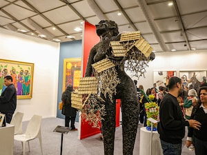 Visitors throng around K S Radhakrishnan's bronze sculpture ' Chhatarpur Pahari' during the opening day's BMW VIP preview of the India Art Fair in NSIC grounds, Okhla, New Delhi on February 05, 2026. The fair will close on Sunday February 08, 2026. 
Photo by Madhu Kapparath