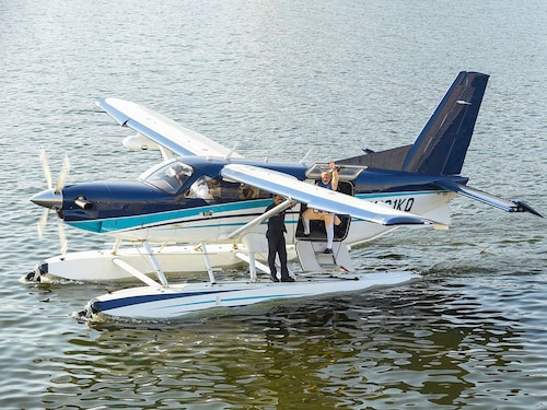 (File) Indian Prime Minister Narendra Modi (C) waves as he stands on a seaplane after landing at the Sabarmati river in Ahmedabad.
(Photo by SAM PANTHAKY / AFP)