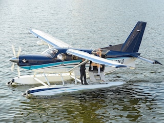(File) Indian Prime Minister Narendra Modi (C) waves as he stands on a seaplane after landing at the Sabarmati river in Ahmedabad.
(Photo by SAM PANTHAKY / AFP)
