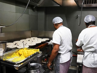 Dosas are cooked on heated griddles fired by LPG cylinders at the popular Vidyarthi Bhavan restaurant in Bengaluru, even as restaurants and hotels have warned of shutdowns amid disruptions in commercial LPG supply, following the U.S.-Israeli conflict with Iran, March 10, 2026.  Photo by Priyanshu Singh / Reuters