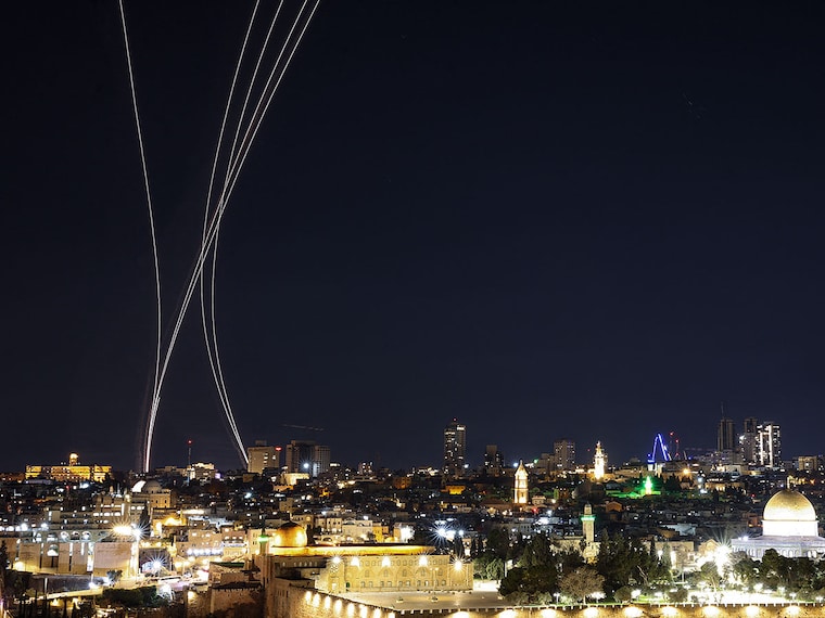 Rocket trails from an interception by Israel's Iron Dome missile defence system are pictured over Jerusalem on March 1, 2026. The United States and Israel launched strikes against Iran on February 28, with Israel's public broadcaster reporting that the Iranian supreme leader had been targeted, as the Islamic republic retaliated with barrages of missiles at Gulf states and Israel. Photo by Hazem Bader / AFP