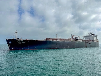 Indian vessel 'Nanda Devi' carrying liquefied petroleum gas (LPG) arrives at Vadinar Port in the Jamnagar district of Gujarat state on March 17, 2026 after Iran allowed it to pass through the Strait of Hormuz. Indian-flagged tankers 'Shivalik' and 'Nanda Devi', carrying around 92,700 metric tonnes of LPG, had reached ports in Gujarat, India. Photo by AFP