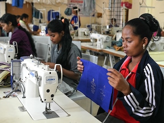 A former Maoist insurgent works on a sewing machine at Dantewada district’s rehabilitation centre for surrendered Maoists, in Chhattisgarh’s Bastar division on March 30, 2026. India on March 30 declared the country free of the Maoist insurgency, fulfilling a long-standing deadline to defeat the decades-long rebellion. Home Minister Amit Shah told parliament that India was "free" of the rebels, known as Naxals. Photo by Shammi Mehra / AFP