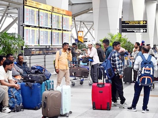 Passengers with their luggage awaiting information about their flights at the Terminal-3 Delhi airport after many flights cancelled  due to airspace restrictions over Iran and parts of the Middle East on March 1, 2026 in New Delhi, India.  Photo by Arvind Yadav/Hindustan Times via Getty Images