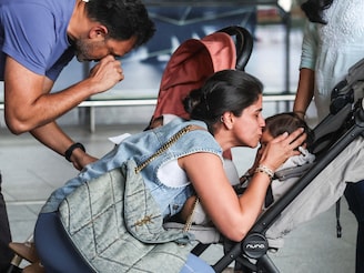 A mother kisses her child, upon the children's return from Dubai amidst the U.S.-Israel conflict with Iran, at the Chhatrapati Shivaji Maharaj International Airport in Mumbai, India, March 3, 2026. Photo by Francis Mascarenhas / Reuters