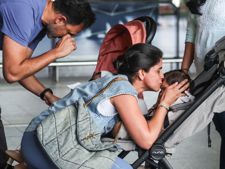 A mother kisses her child, upon the children's return from Dubai amidst the U.S.-Israel conflict with Iran, at the Chhatrapati Shivaji Maharaj International Airport in Mumbai, India, March 3, 2026. Photo by Francis Mascarenhas / Reuters