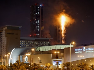 Smoke rises from a burning building hit by an Iranian drone strike in Manama, Bahrain, February 28, 2026. Photo by Stringer / Reuters