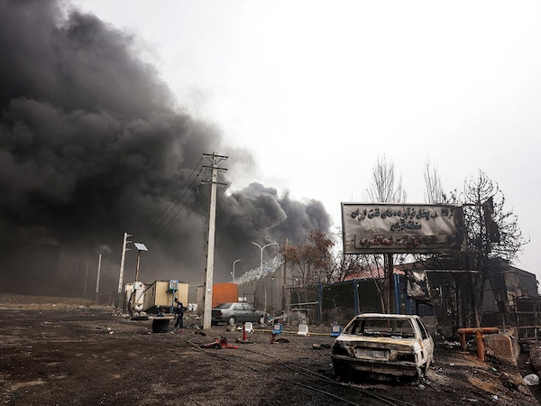 (File) Smoke plumes rise from an ongoing fire following an overnight airstrike on the Shahran oil refinery in northwestern Tehran on March 8, 2026. This is the result of the strikes launched by the United States and Israel against Iran on Feb 28, sparking swift retaliation by the Islamic republic. Photo by AFP