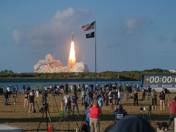 People watch as NASA's Artemis II Space Launch System rocket carrying the Orion spacecraft lifts off from  Kennedy Space Center on April 1, 2026 in Cape Canaveral, Florida. Photo by Chip Somodevilla/Getty Images