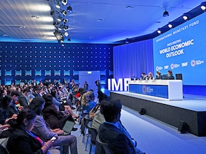 The IMF has raised India growth forecast to 7 percent for FY27; Photo by Lillian Suwanrumpha / AFP

