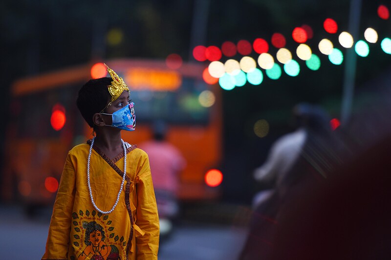 A boy dressed as the Hindu deity Krishna is seen outside Birla Mandir ahead of Janmashtami on August 11, 2020 in New Delhi, India.