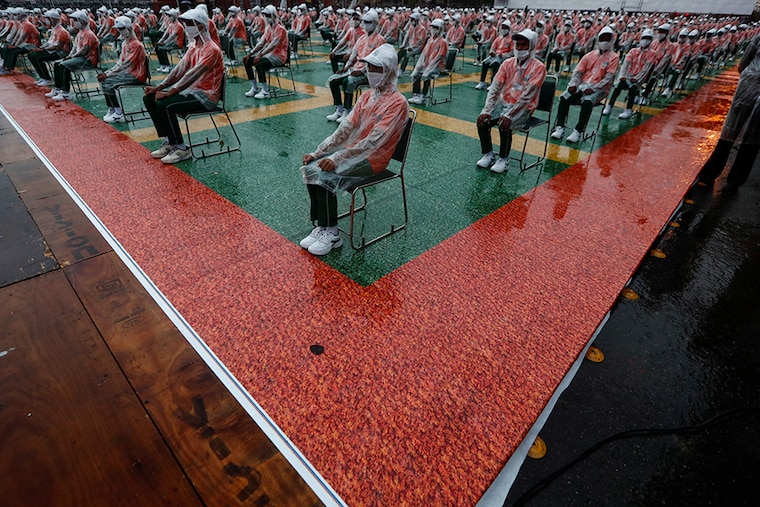 School children wearing face masks take part in a full-dress rehearsal for India"s Independence Day celebrations at the historic Red Fort in Delhi, India, August 13, 2020