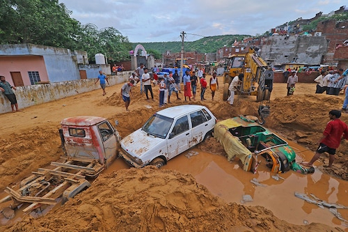 Vehicles buried in landslide rubble following heavy rainfall being salvaged at Sundar Nagar Ganesh Vihar colony, Lal Dungari, in Jaipur, Rajasthan, India, Aug 16,2020.