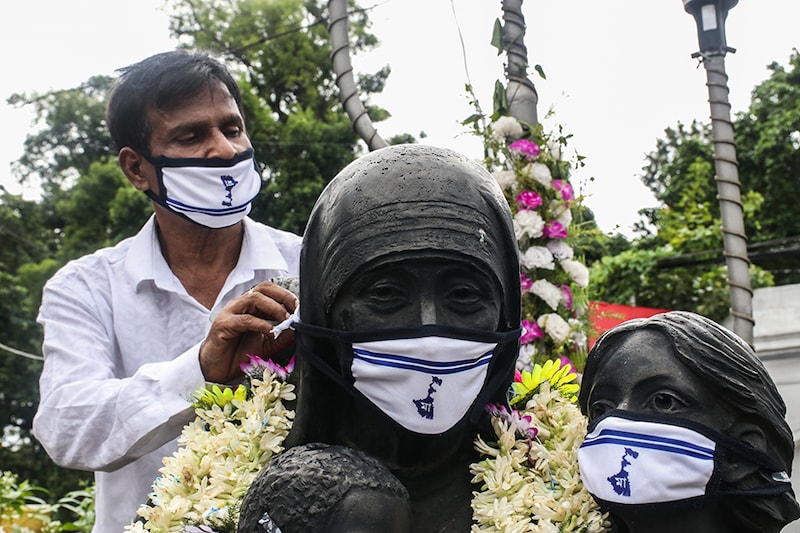Social activists put a face mask on Mother Teresa"s statue to create awareness for COVID-19 on her 110th birth anniversary in Kolkata, India on August 26, 2020