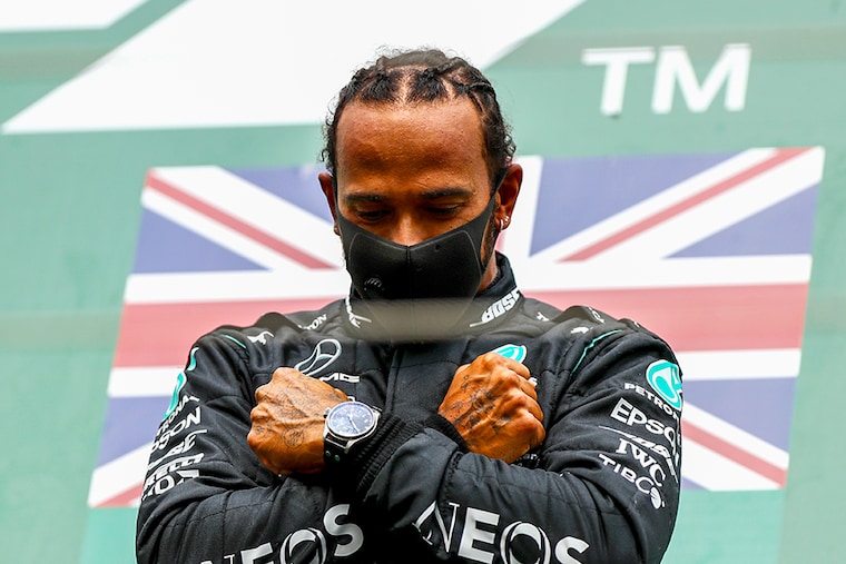 Race winner Lewis Hamilton of Great Britain and Mercedes GP celebrates on the podium with a tribute to the late Chadwick Boseman during the F1 Grand Prix of Belgium at Circuit de Spa-Francorchamps on August 30, 2020 in Spa, Belgium
