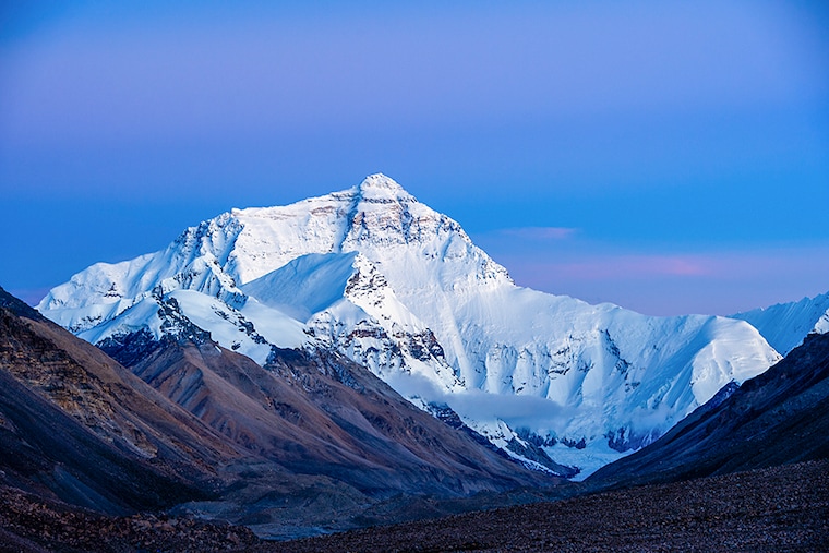 Mount Qomolangma or Mount Everest – the highest mountain in the world pictured in Shigatse, Tibet Autonomous Region of China. The new height of Mount Qomolangma is 8,848.86 meters, China and Nepal announced on Tuesday. Its most common Tibetan name, Chomolungma, means “Goddess Mother of the World” or “Goddess of the Valley.” The Sanskrit and Nepali Sagarmatha means “Peak of Heaven.”