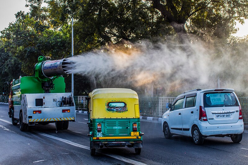 A municipal vehicle sprays disinfectant as part of measures to battle the Covid-19 coronavirus pandemic on December 16, in New Delhi, India. India currently has the largest number of confirmed cases in Asia and has the second-highest number of confirmed cases in the world after the United States. India on Wednesday recorded 26,382 fresh Covid-19 cases, taking the country"s total tally to 9.9 million according to the Union Health Ministry"s data. The active caseload of the country stands at 3,30,007. India has recorded less than 40,000 daily new cases since the last 17 days. The country"s death toll has mounted to 1,44,144.
