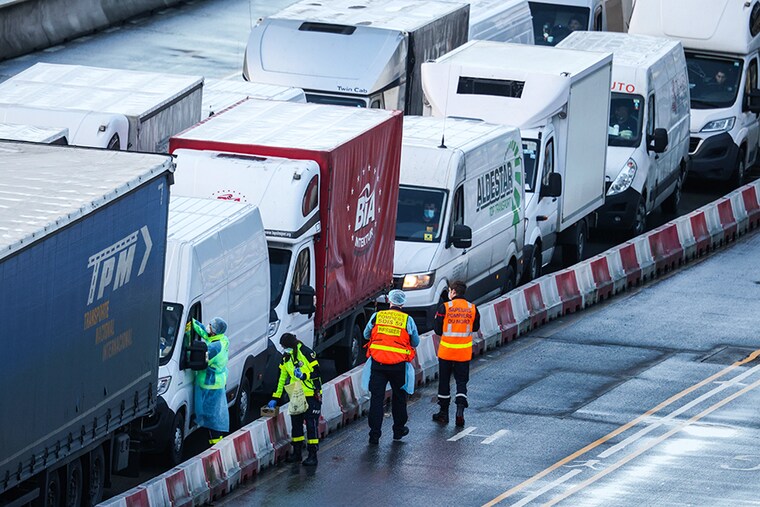 Members of the French Federation of Rescue and First Aid and the French Fire Service swab drivers to test for Covid-19 on December 24, 2020 in Dover, United Kingdom. Travel from the UK to France gradually resumed on Wednesday morning after being suspended for more than two days due to concerns about a new strain of Covid-19. The British government deployed its Track and Trace team to administer Covid-19 tests to lorry drivers waiting to cross at Dover.