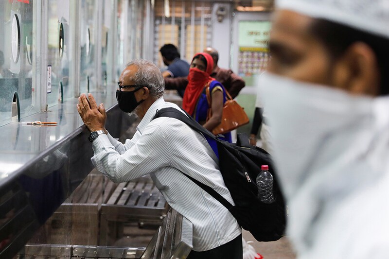 A man pleads for a ticket at a Railway reservation ticket counter after a few restrictions were lifted during an extended nationwide lockdown to slow the spread of the coronavirus disease (COVID-19), in New Delhi, India, June 1, 2020.