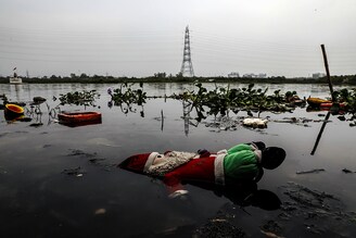 A stuffed toy is seen lying in the waters of the Yamuna river ahead of World Environment Day, in the old quarters of Delhi, India, June 4, 2020