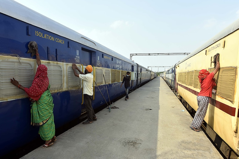A train coach is cleaned while being converted into an isolation ward for COVID-19 patients on June 15, 2020 in New Delhi, India. All platforms at Anand Vihar Railway Station have been reserved for the deployment of isolation coaches that will address coronavirus patients