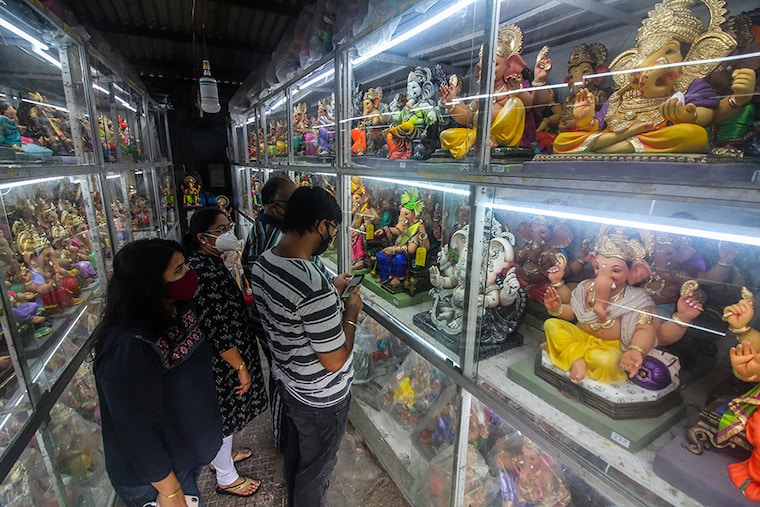 Devotees buy idols of Hindu god Ganesha at a shop in Mumbai, India on June 28, 2020. India has begun gradually lifting its restrictions imposed by the government to slow the spread of the Coronavirus (COVID-19) pandemic.