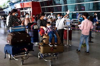 Passengers arrive at the Indira Gandhi International airport in New Delhi on the first day of resuming of domestic flights after the government imposed a nationwide lockdown as a preventive measure against the spread of the COVID-19 coronavirus. May 25, 2020