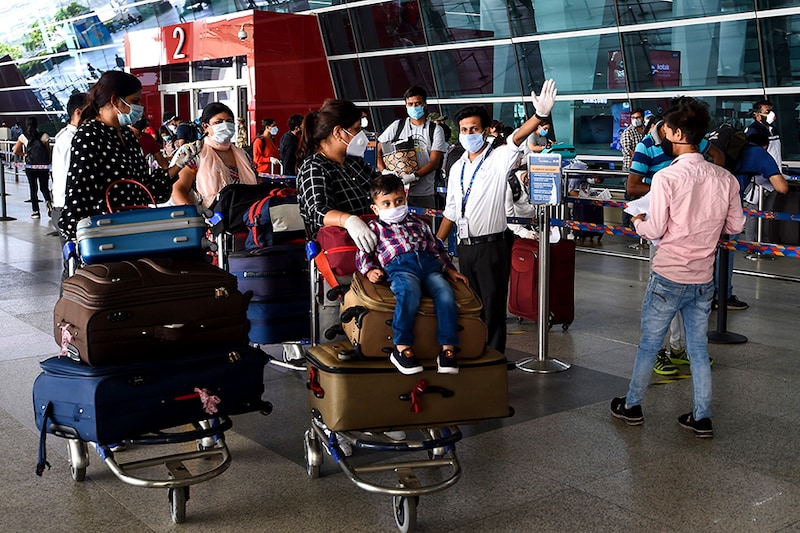 Passengers arrive at the Indira Gandhi International airport in New Delhi on the first day of resuming of domestic flights after the government imposed a nationwide lockdown as a preventive measure against the spread of the COVID-19 coronavirus. May 25, 2020