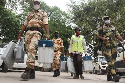VVPAT and EVM machines prepared being dispatched under the watch of security personnel from a distribution centre ahead of the second phase of Bihar assembly election, at B.S. College, Danapur on November 2 in Patna, India.