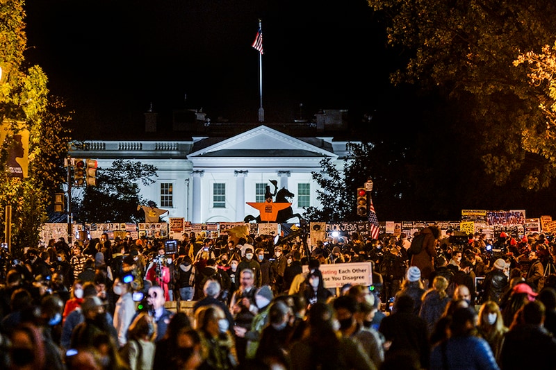 People fill Black Lives Matter Plaza near the White House in Washington, on Election Day, Tuesday, Nov. 3, 2020.