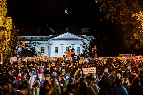 People fill Black Lives Matter Plaza near the White House in Washington, on Election Day, Tuesday, Nov. 3, 2020.