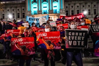 Demonstrators hold up signs during a Count Every Vote demonstration at Pennsylvania State Capitol on November 05, 2020 in Harrisburg, Pennsylvania.