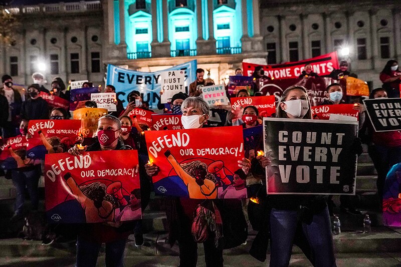 Demonstrators hold up signs during a Count Every Vote demonstration at Pennsylvania State Capitol on November 05, 2020 in Harrisburg, Pennsylvania.