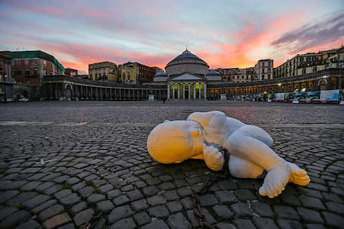The sculpture of the artist Jacopo Cardillo, called Jago, entitled Look Down and depicting a fetus with a chain, installed in the center of Piazza Plebiscito in Naples, as a warning about the conditions in which the citizen lives today during the COVID-19 coronavirus pandemic.