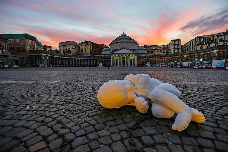 The sculpture of the artist Jacopo Cardillo, called Jago, entitled Look Down and depicting a fetus with a chain, installed in the center of Piazza Plebiscito in Naples, as a warning about the conditions in which the citizen lives today during the COVID-19 coronavirus pandemic.