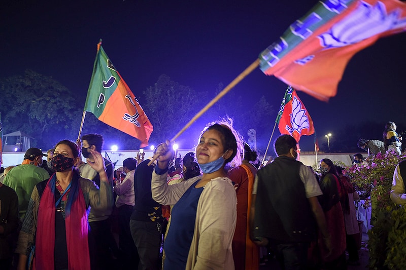 BJP supporters in a celebratory mood after counting for the Bihar assembly election showed leads for the NDA, at the party headquarters on November 10, 2020 in New Delhi, India. The NDA maintained an edge over the RJD-led Grand Alliance as counting progressed slowly in Bihar.