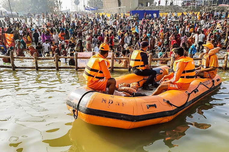 An NDRF team in a boat monitors Chhath celebrations by the banks of the river Ganga, at Gandhi Ghat on November 18, 2020 in Patna, India.