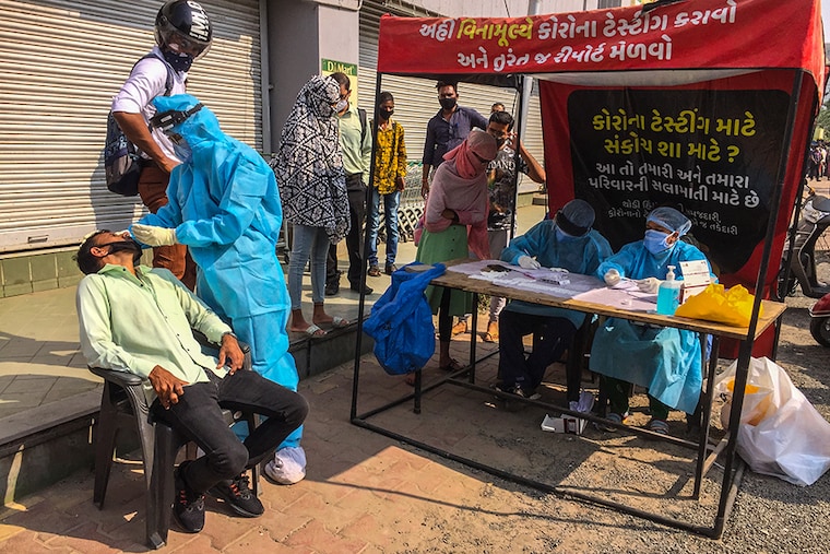 Ahmedabad Municipal corporation undertaking the rapid antigen Covid-19 test on November 20, while the Gujarat government has announced a complete curfew in the city until Monday, amidst a rise of coronavirus cases. Only shops selling milk and medicines will remain open. After Monday, a night curfew is expected to persist.