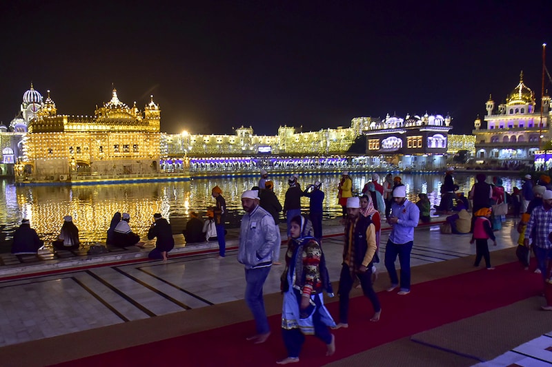Devotees seen at the Golden Temple on the eve of the 551st birth anniversary of Guru Nanak Dev, on November 29, 2020 in Amritsar, India.