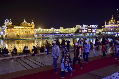 Devotees seen at the Golden Temple on the eve of the 551st birth anniversary of Guru Nanak Dev, on November 29, 2020 in Amritsar, India.