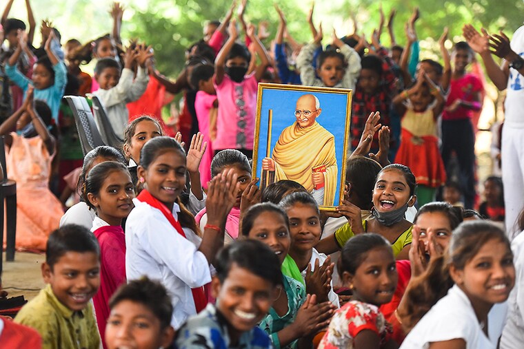 Students of Panchsheel Shikshan Sansthan celebrate Gandhi Jayanti at Panchsheel Shikshan Sansthan in Yamuna Khadar, Mayur Vihar, on October 2, 2020 in New Delhi, India. Born on October 2 in 1869, Mahatma Gandhi is one of the most revered leaders in India and across the world. He is known as the Father of the Nation for his role in the countrys fight against the British, which led to India gaining freedom in 1947. Throughout his life, Mahatma Gandhi gave a message of non-violence and inspired people around the world to follow the path of truth.
