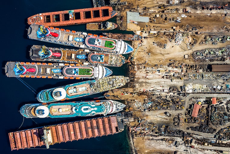In this aerial view from a drone, five luxury cruise ships are seen being broken down for scrap metal at the Aliaga ship recycling port on October 02, 2020 in Izmir, Turkey. With the global coronavirus pandemic pushing the multi-billion dollar cruise industry into crisis, some cruise operators have been forced to cut losses and retire ships earlier than planned. The cruise industry has been one of the hardest hit industries with public confidence in cruise holidays plummeting after a series of outbreaks occurred on cruise liners as the pandemic spread. The crisis however has bolstered the years intake of ships at the Aliaga ship recycling port with business up thirty percent on the previous year.