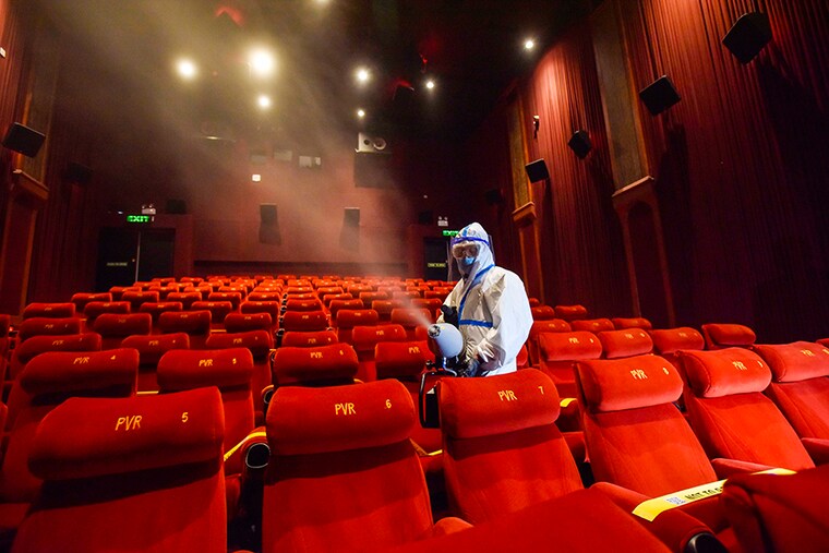 A worker chemically disinfects a cinema hall at PVR ICON during a press preview of preparedness for reopening halls amid the Covid-19 pandemic, at DLF Promenade Mall, Vasant Kunj on October 14, 2020 in New Delhi, India. Multiplexes and cinema halls have been allowed to reopen from October 15, with up to 50 per cent of their seating capacity, under Unlock 5.0. Standard operating procedures (SOPs) have been issued by the central government.