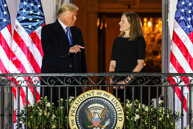 President Donald Trump and newly sworn-in U.S. Supreme Court Associate Justice Amy Coney Barrett speak during a ceremonial swearing-in on the South Lawn of the White House October 26, 2020 in Washington, DC. The Senate confirmed Barrett’s nomination to the Supreme Court today by a vote of 52-48.