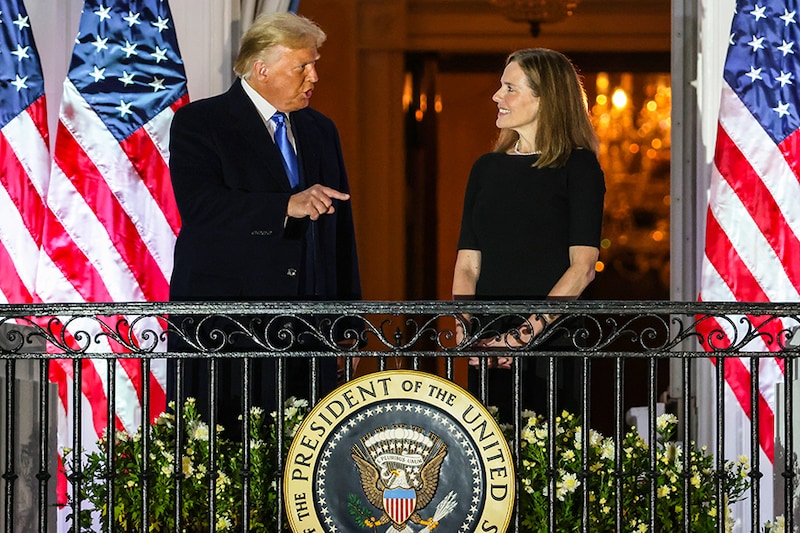 President Donald Trump and newly sworn-in U.S. Supreme Court Associate Justice Amy Coney Barrett speak during a ceremonial swearing-in on the South Lawn of the White House October 26, 2020 in Washington, DC. The Senate confirmed Barrett’s nomination to the Supreme Court today by a vote of 52-48.