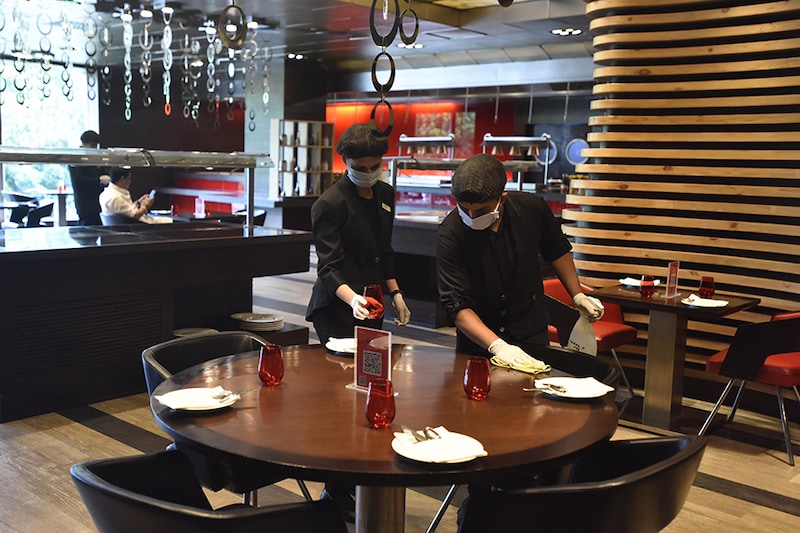 Employees sanitise the hotel premises, at Le Meridien Hotel ahead of its reopening in Unlock 4.0, on August 31, 2020 in New Delhi, India.