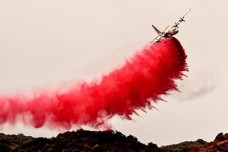 A tanker plane makes a Phos-Chek fire retardant drop in the San Gabriel Mountains during the Bobcat Fire in Monrovia on Wednesday, September 9, 2020.