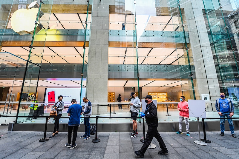 Cutsomers wait outside ready to shop at the Apple Store in George Street on September 18, 2020 in Sydney, Australia. Customers to the Apple stores in Australia are among some of the first in the world to be able to view Apple"s newest products. The new Apple Watch Series 6 features a blood oxygen sensor and app, while a new iPad (8th generation) has also been released.