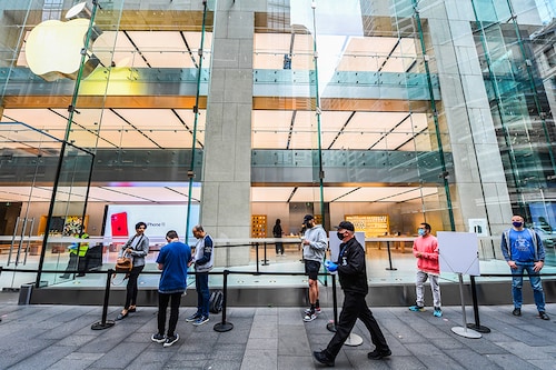 Cutsomers wait outside ready to shop at the Apple Store in George Street on September 18, 2020 in Sydney, Australia. Customers to the Apple stores in Australia are among some of the first in the world to be able to view Apple"s newest products. The new Apple Watch Series 6 features a blood oxygen sensor and app, while a new iPad (8th generation) has also been released.